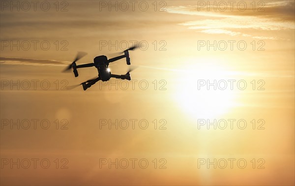 Drone flying at sunset