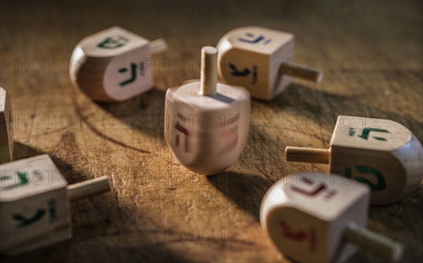 Dreidels on wooden table