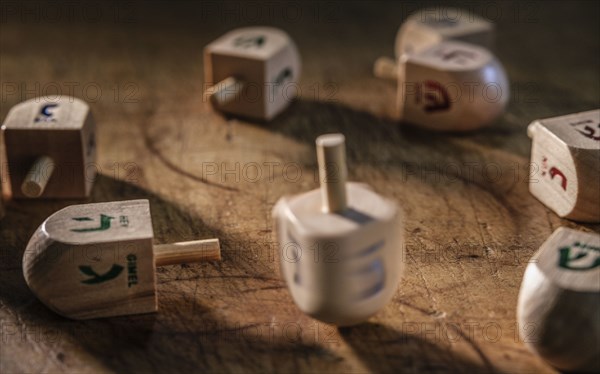 Dreidels on wooden table