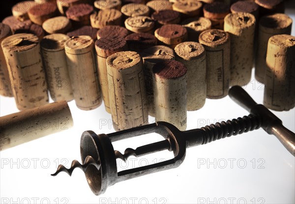 Corkscrew and collection of corks