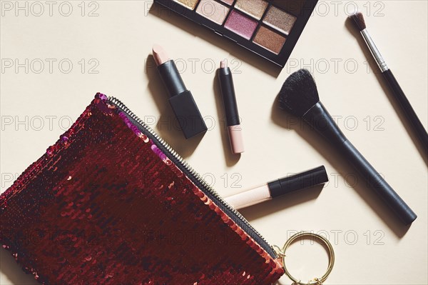 Make-up and red purse