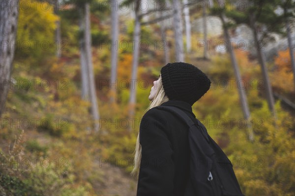 young woman in autumn forest