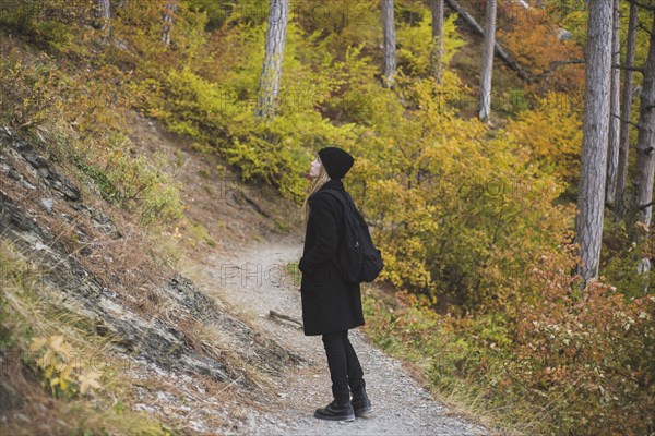 young woman in autumn forest