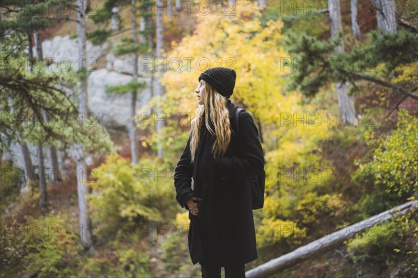 young woman in autumn forest