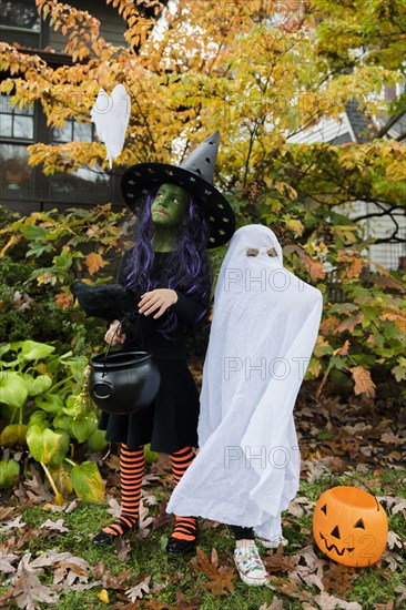 Boy and girl in Halloween costumes