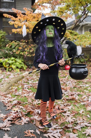 Girl in witch costume for Halloween