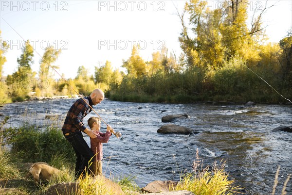 Father and son fishing together