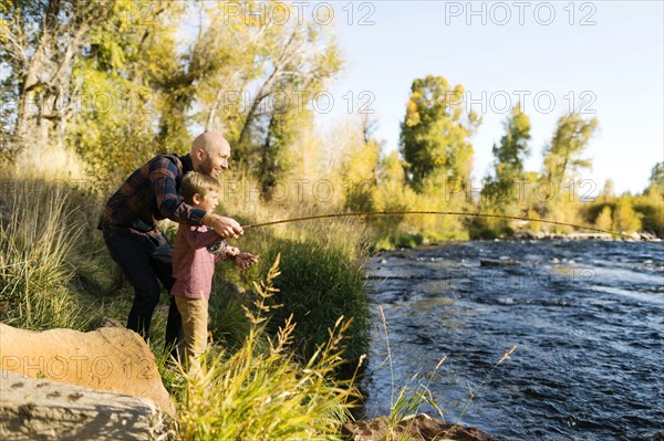 Father and son fishing together