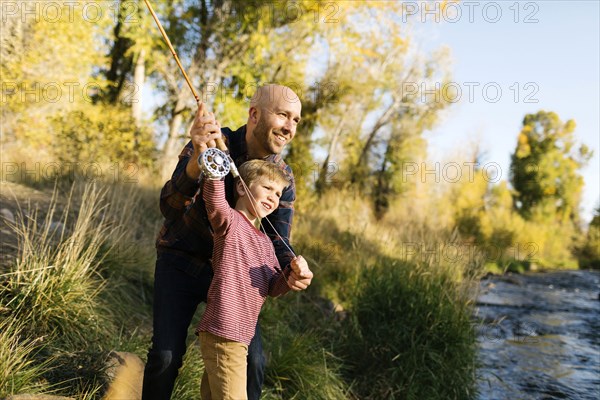 Father and son fishing together