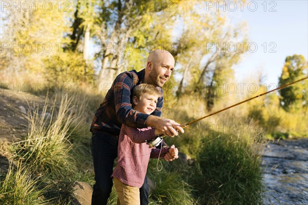 Father and son fishing together