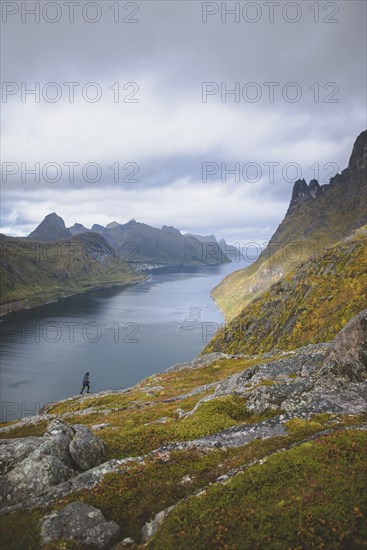 young man hiking on mountain in Norway