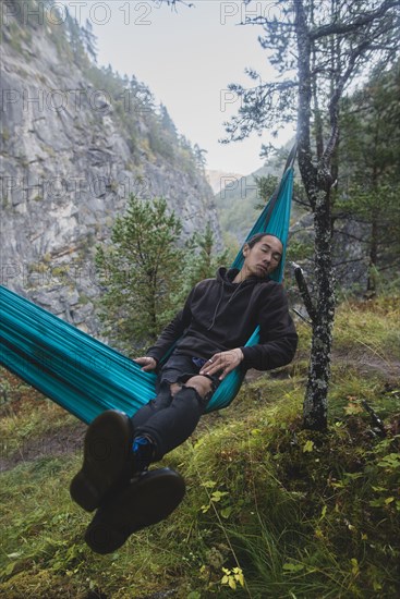 young man resting in hammock