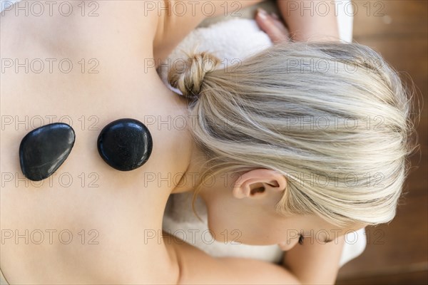 Woman enjoying hot stone massage