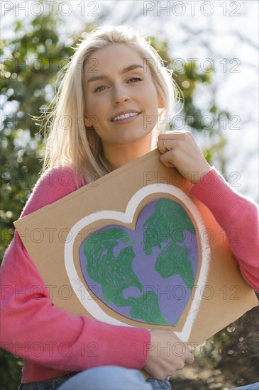 Woman holding climate change protest sign