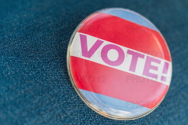 Close up of Vote button on jeans fabric