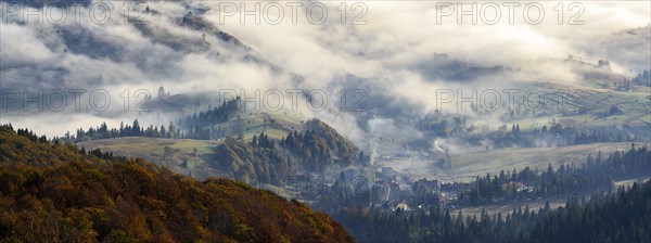 Ukraine, Zakarpattia region, Carpathians, Borzhava, Foggy hills of Carpathian Mountains at sunrise