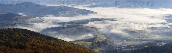 Ukraine, Zakarpattia region, Carpathians, Borzhava, Foggy hills of Carpathian Mountains at sunrise