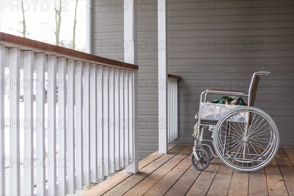 Empty wheelchair on porch