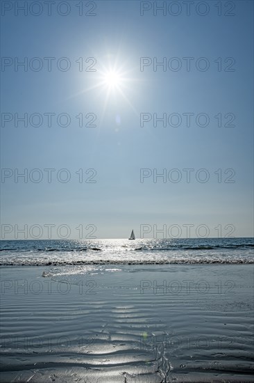 Lone sailboat in ocean