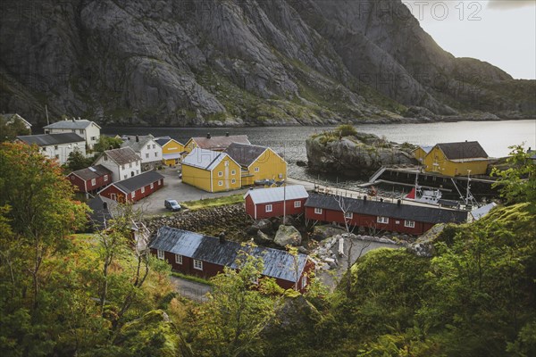 Norway, Lofoten Islands, Nusfjord, Scenic view of traditional fishing village with red houses
