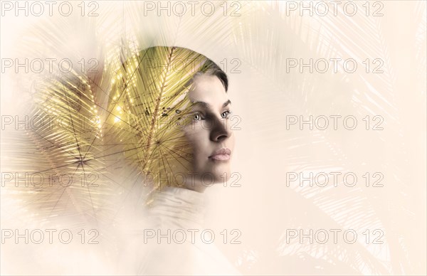 Double exposure of woman and fronds