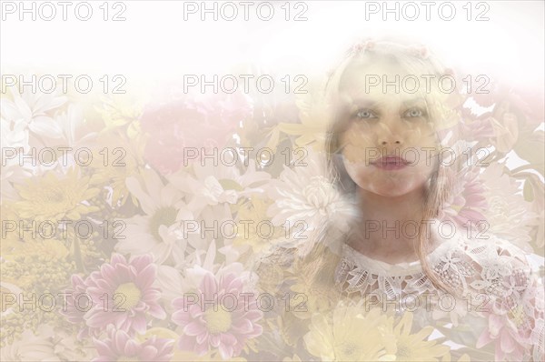 Double exposure of woman and flowers