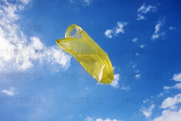 Yellow plastic bag in sky