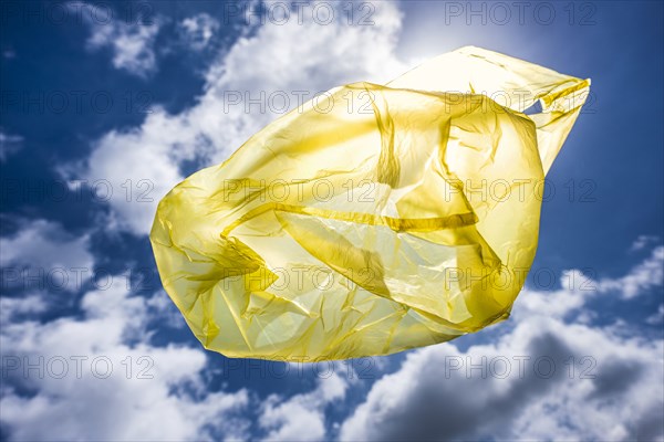 Yellow plastic bag in sky