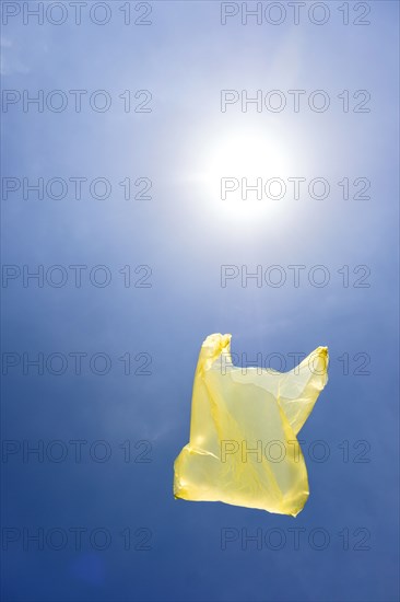 Yellow plastic bag in sky