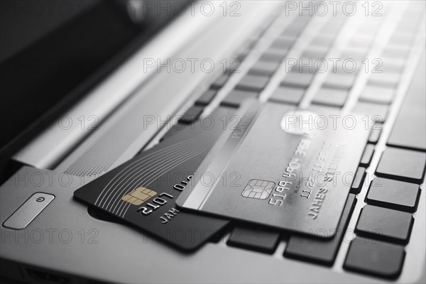 Credit cards on laptop keyboard