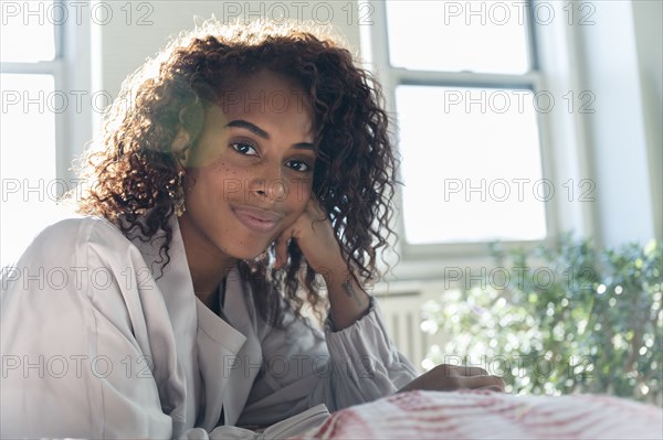 Woman leaning on her hand