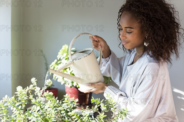 Woman watering plants