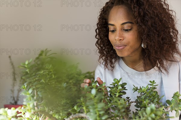 Woman touching plants