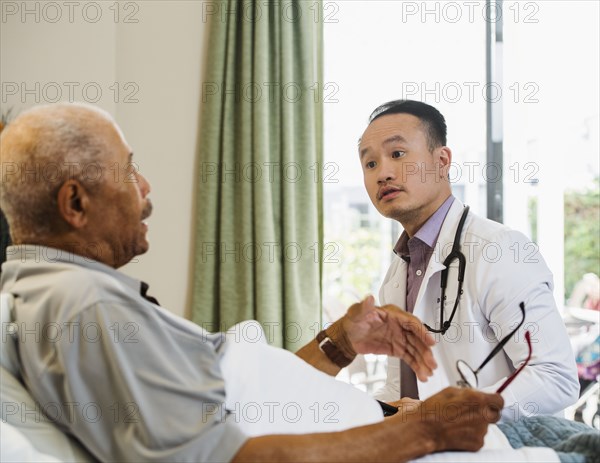 Senior man talking to doctor