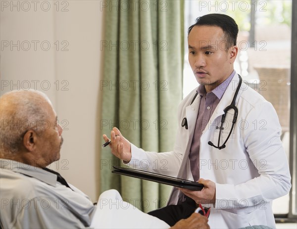 Doctor talking to senior man