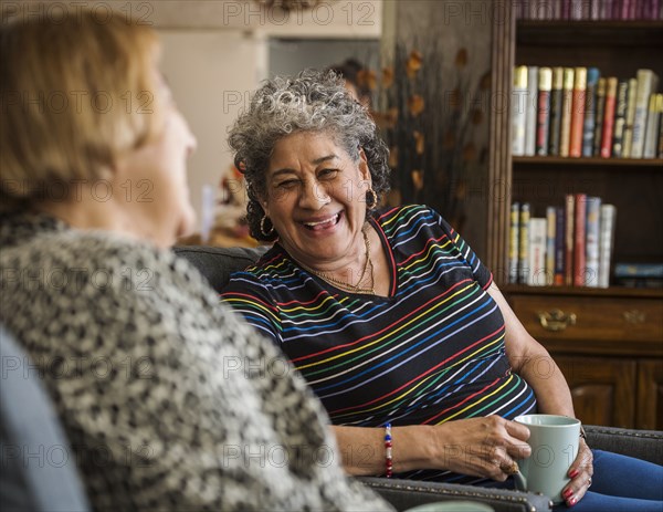 Smiling senior woman holding cup