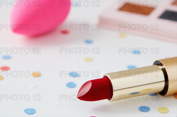 Make-up, sponge and confetti