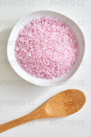 Bath salt in bowl and wooden spoon