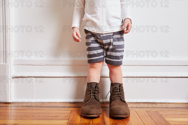 Girl wearing oversized boots