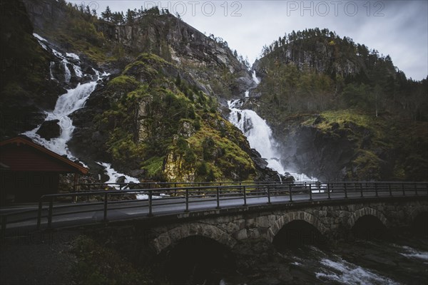 Road by Latefossen waterfall in Vestland, Norway