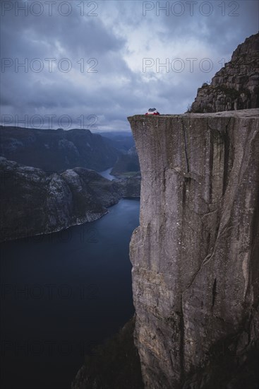 Tent in distance on Preikestolen cliff in Rogaland, Norway