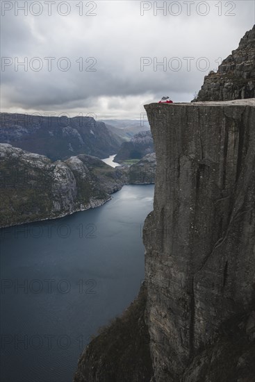 Tent in distance on Preikestolen cliff in Rogaland, Norway