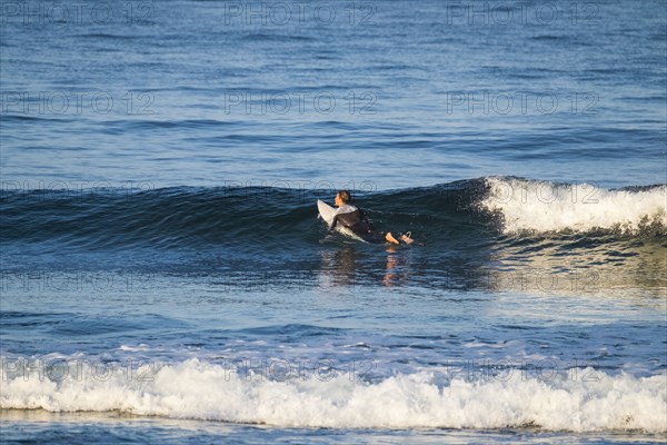 Teenage boy surfing