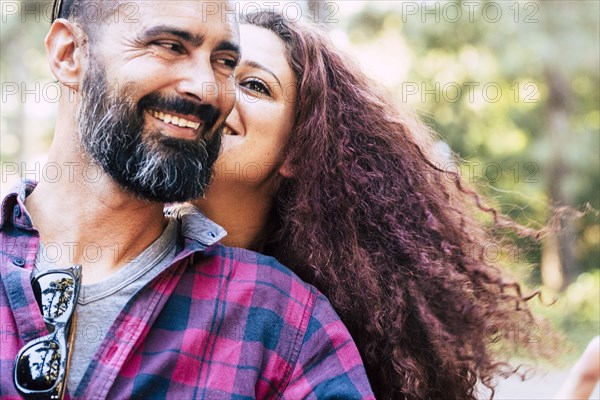 Smiling couple by trees