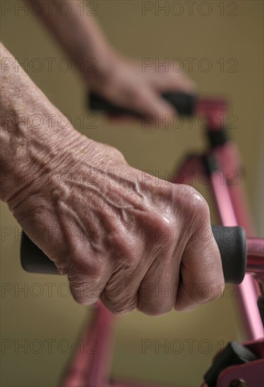 Close up of hands of senior woman on mobility walker