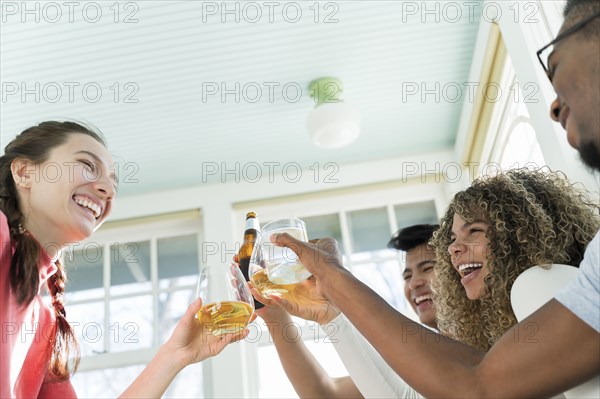 Friends having toast with drinks together