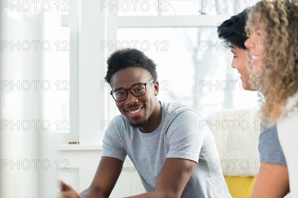 Portrait of young man hanging out with friends