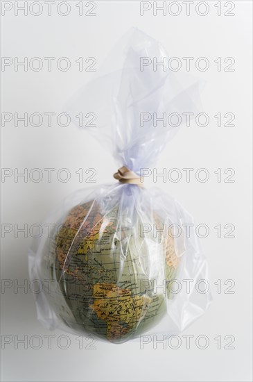 Earth globe in plastic bag