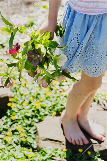 Girl holding bouquet of flowers