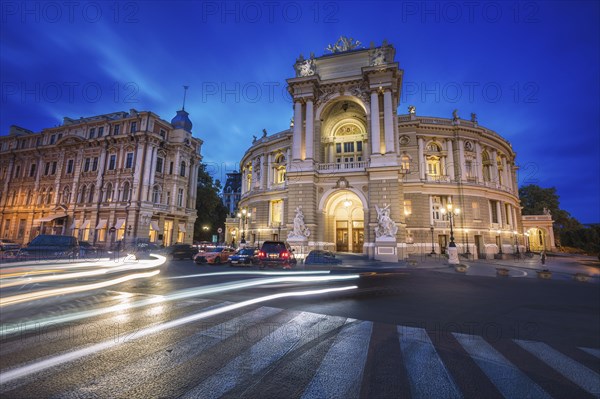 Ukraine, Odessa Oblast, Theater building illuminated at dusk